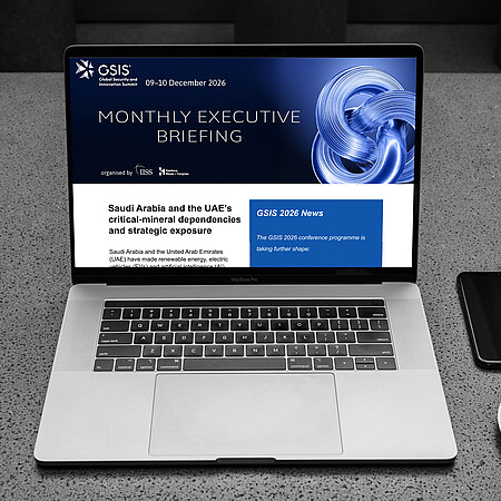 GSIS Executive Briefing | Mockup (Notebook with Newsletter on screen, coffee cup, smartphone)